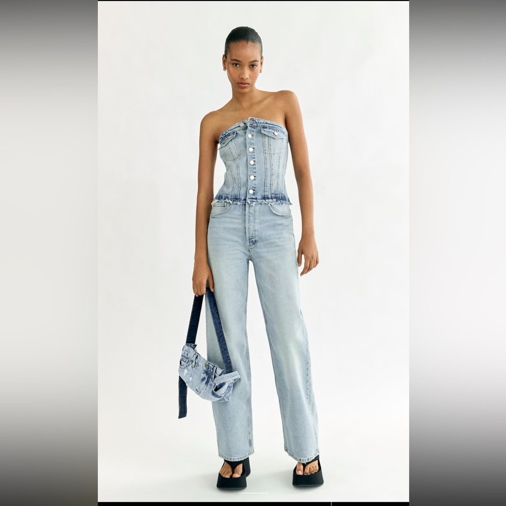 Zara light wash denim jumpsuit size XL strapless and button front.